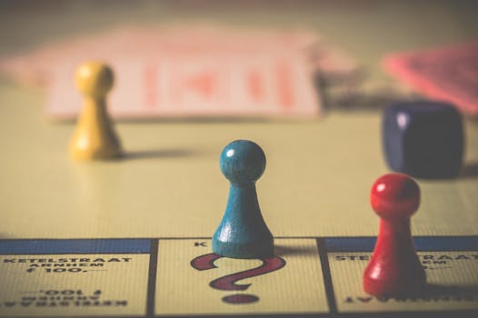 Close-up of a classic board game with vibrant tokens and dice on a playing board.