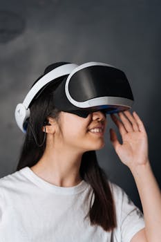 Close-up of a young woman immersed in virtual reality using VR goggles.