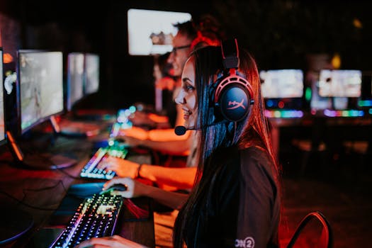 People enjoying a late-night video gaming session with headsets and RGB keyboards.